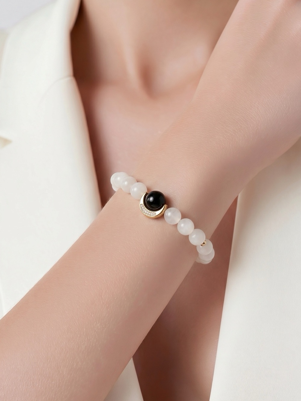 Elegant White Beaded Bracelet with Black Accent and Gold Detail